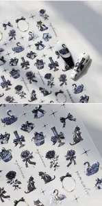 Detailed view of Gothic black swan and rose nail stickers with glitter finish and bow designs