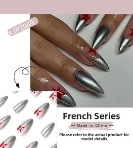 Macro detail of Stiletto press-on nails with silver metallic finish and red stars