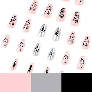 Pink and silver chrome press-on nails with black graffiti hearts and text in coffin shape