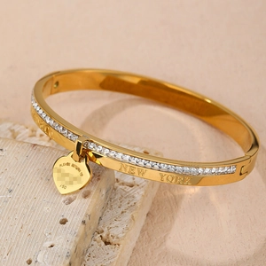 Sparkling 18K rose gold plated bangle with square-cut crystals and a heart charm pendant