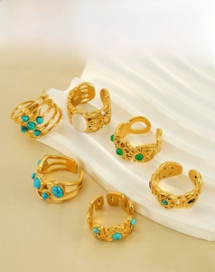 Selection of vintage 18k gold plated stainless steel rings with malachite and gemstones