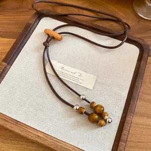 Bohemian wax cord necklace with ceramic beads and tiger eye stone tassels for women