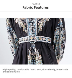 Detailed shot of vintage paisley print dress fabric with a decorative round belt buckle