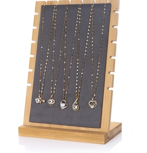 Vertical bamboo necklace display stand with dark grey velvet pad and side notches