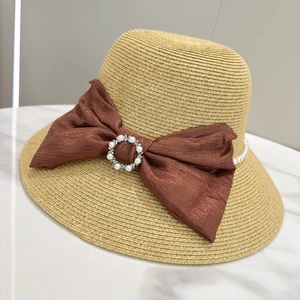 Elegant wide brim straw sun hat with brown bow, pearl chain and rhinestone buckle accent