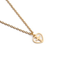 Golden stainless steel heart pendant necklace with cross design on white background