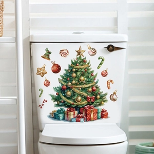 Detail of Christmas tree PVC decal with gift boxes applied to white ceramic toilet tank