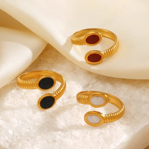 Adjustable gold rings with ribbed texture and oval black white red enamel inlays