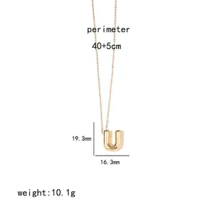 Detail view of golden letter U pendant necklace with specific dimensions and weight details