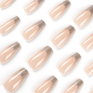 Elegant nude French press-on nails with silver glitter tips on a white background