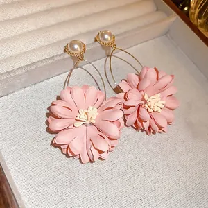 Elegant pink fabric flower drop earrings with white pearls and gold metal rings