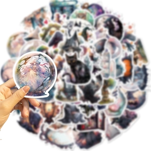 Macro shot of waterproof witch stickers showing crystal ball and magic girl designs