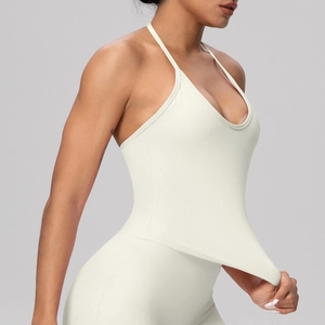 Detail of high-elasticity cream yoga top showing the supportive cross-back neck design