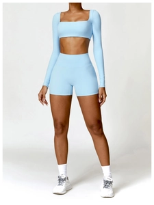 Close-up of baby blue yoga set with square neck long sleeve top and high waist shorts