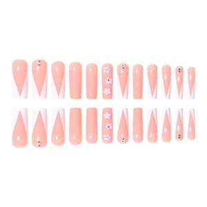 Long coffin fake nails set featuring peach pink V-shaped French tips with floral rhinestone