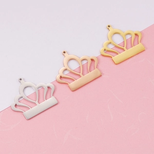 Three crown pendants in silver, rose gold and gold finishes with smooth mirror surface