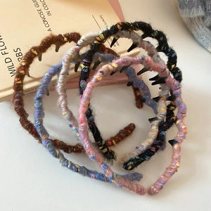 Detail of colorful woolen knit headbands with non-slip inner teeth for hair styling