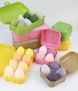 Macro shot of 8pcs colorful teardrop makeup sponges set in clear storage box