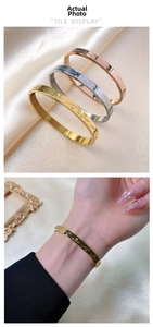 Detailed view of three-color stainless steel bracelets with I Love You and Forever engraving