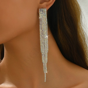 Close-up of model wearing long sparkling rhinestone fringe drop earrings for formal events