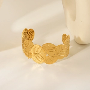 Adjustable gold plated stainless steel cuff bracelet with detailed leaf texture design