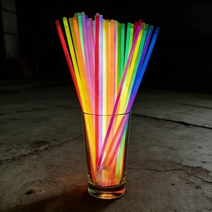 Vibrant multicolor glow sticks in a glass jar, perfect for concerts and night parties