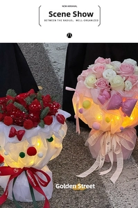 Close-up of elegant rose bouquet with LED warm light and layered artistic gift wrapping