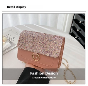 Detail of pink crossbody bag with sequins, gold ring buckle, and chain strap