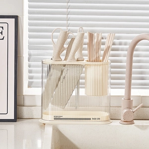 Cream-colored kitchen organizer rack for knives and utensils on a modern countertop