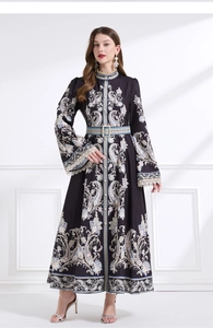 Detail of vintage paisley print dress with lace cuffs and mandarin collar design