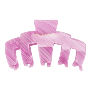 Detailed shot of pink marble texture acetate hair claw clip with Materialistic text