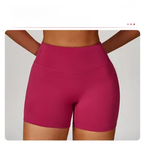 Front detail of high-waisted magenta yoga shorts with seamless stitch-free design