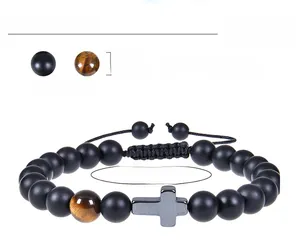 Detail of 8mm black matte stone bracelet with tiger eye bead and adjustable woven cord