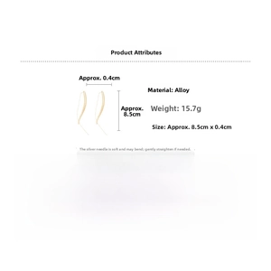 Detail view of gold curved drop earrings with measurements 8.5cm and silver pins