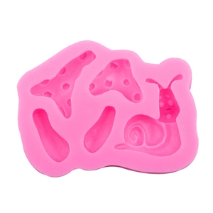 Pink silicone mold featuring forest mushroom and snail shapes for cake decorating