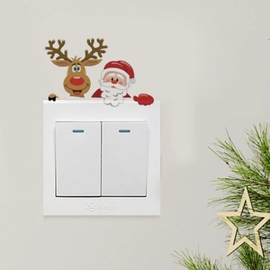 Detailed view of watercolor Santa and reindeer stickers on a wall switch decoration