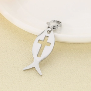 Detailed close-up of a silver stainless steel fish pendant with cross cutout and lobster clasp