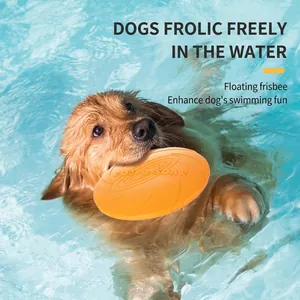 Orange floating dog frisbee toy for water training, held by a Golden Retriever in a pool