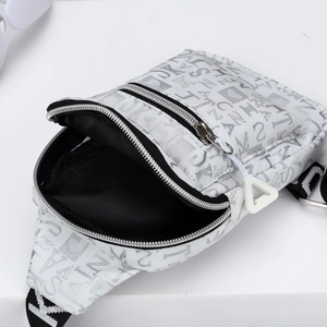 White nylon crossbody chest bag with silver lettering and black patterned strap