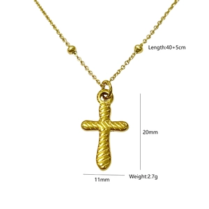 Detail of gold cross pendant with spiral relief texture and 40+5cm beaded chain
