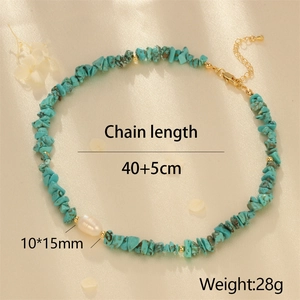Detail of turquoise stone necklace featuring 10*15mm baroque pearl and gold clasp