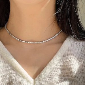 Elegant silver tennis choker with sparkling zircon stones worn on a model's neck
