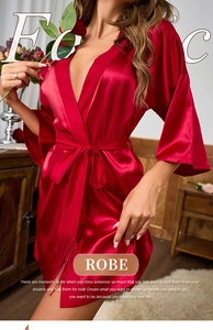 Detail of red satin robe showing V-neck design and silk texture with tasseled waist tie
