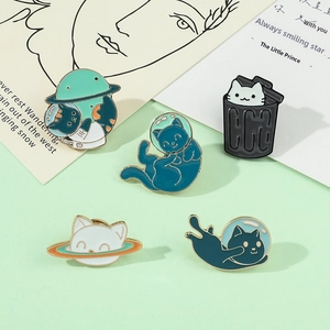 Set of five cute astronaut cat enamel pins with space themes on a soft green background