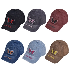 Denim baseball caps with butterfly embroidery and Free Flight text in six colors