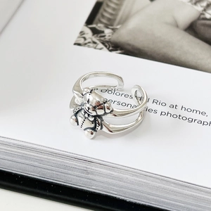 Detailed macro of a 925 sterling silver bear ring with vintage finish and open band