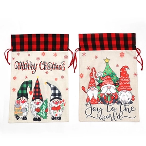 Set of 2 Christmas gnome drawstring gift bags with red buffalo plaid trim and festive prints