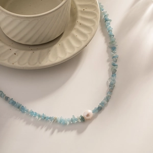 Blue natural stone necklace with white pearl accent on a durable titanium steel chain