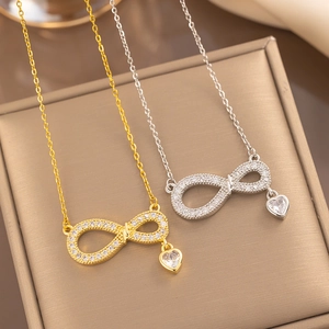 Elegant gold and silver infinity heart necklaces with micro-set zircon on display