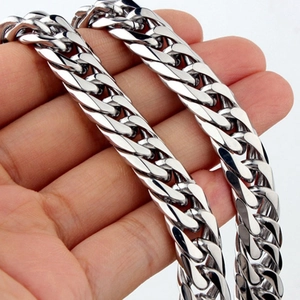 Detailed view of heavy silver stainless steel Cuban link chain with metallic luster